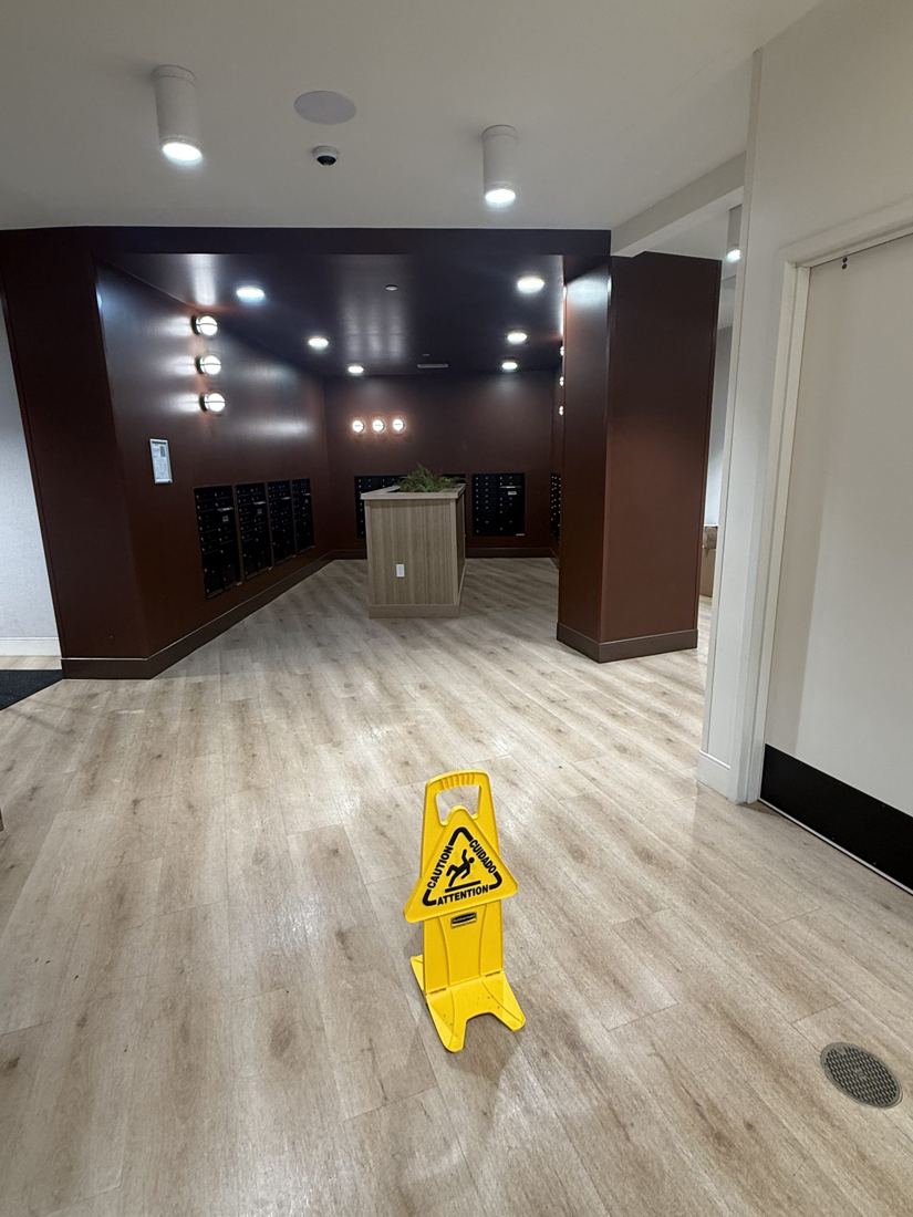 Lobby floor with wet floor signs